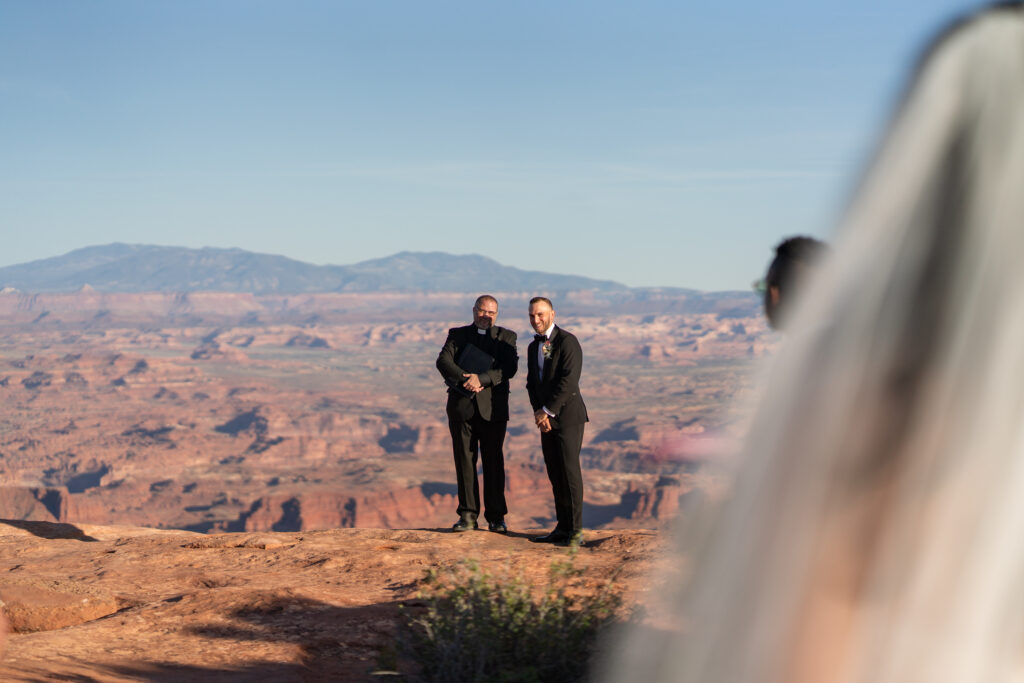 Ceremony at overlook in Canyonlands National Park — Sunset vows with canyon backdrop and bilingual officiant.