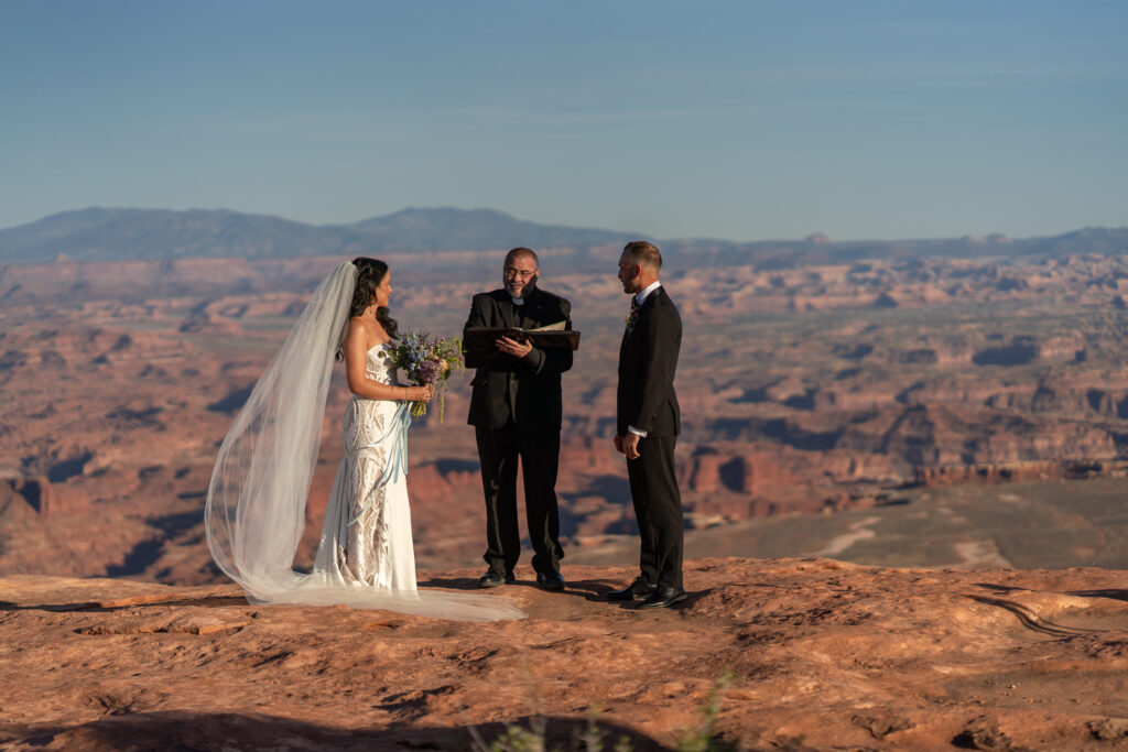 Ceremony at overlook in Canyonlands National Park — Sunset vows with canyon backdrop and bilingual officiant.