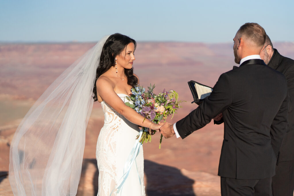 Ceremony at overlook in Canyonlands National Park — Sunset vows with canyon backdrop and bilingual officiant.
