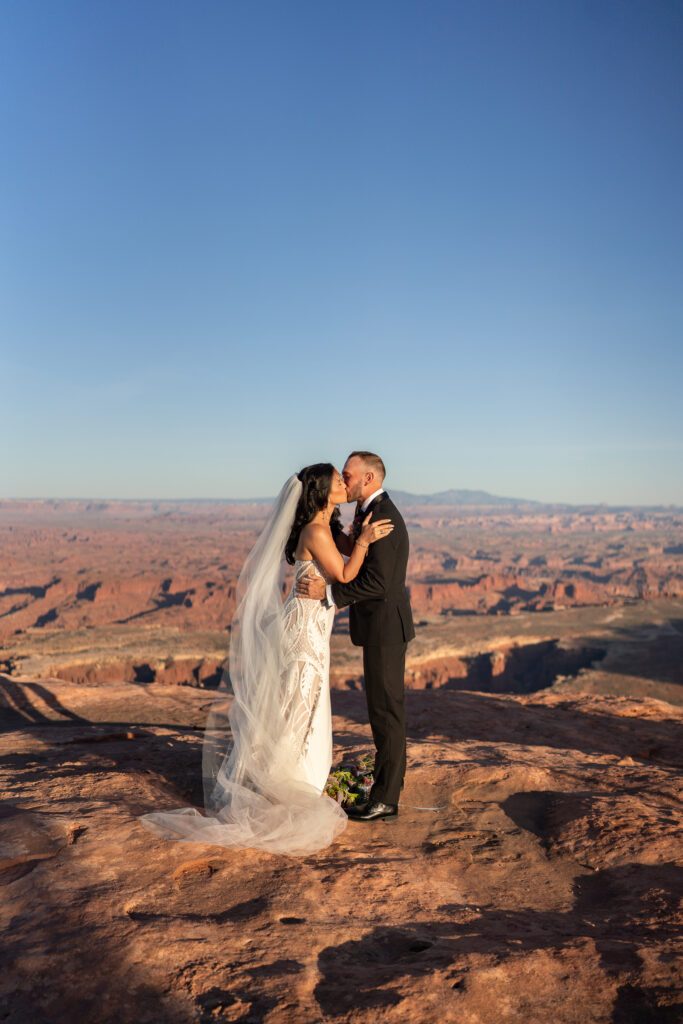 Bride and groom First kiss during a utah elopement