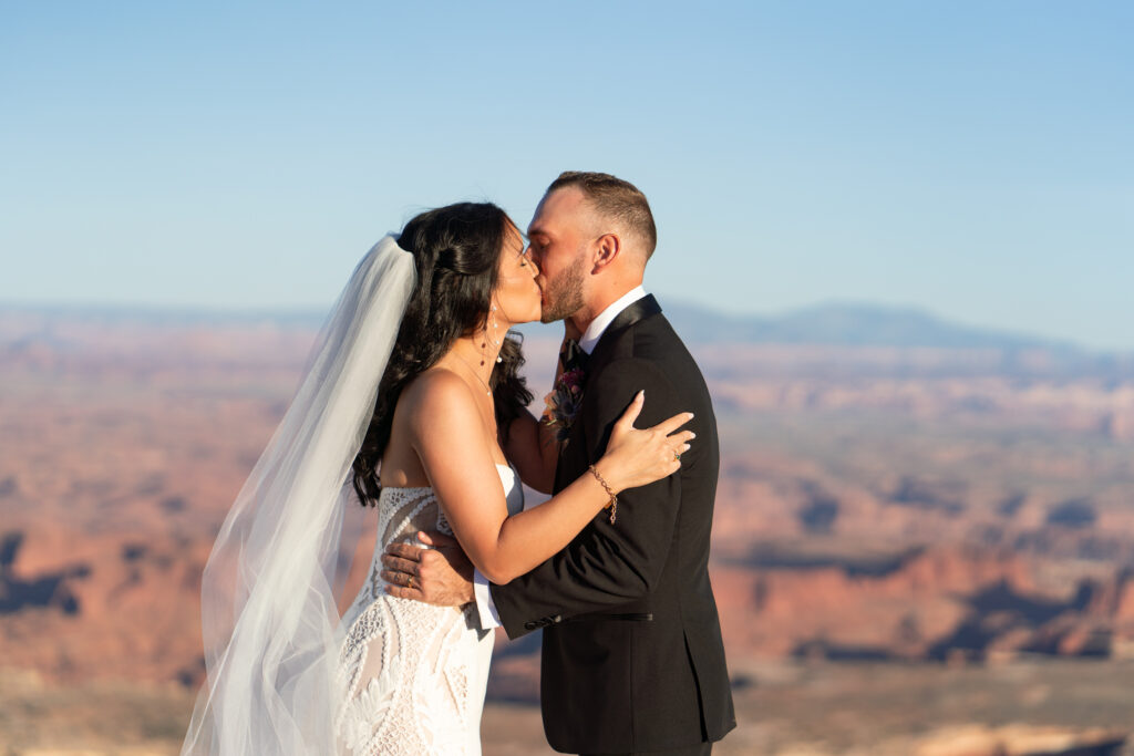 First kiss during a wedding ceremony in Moab utah