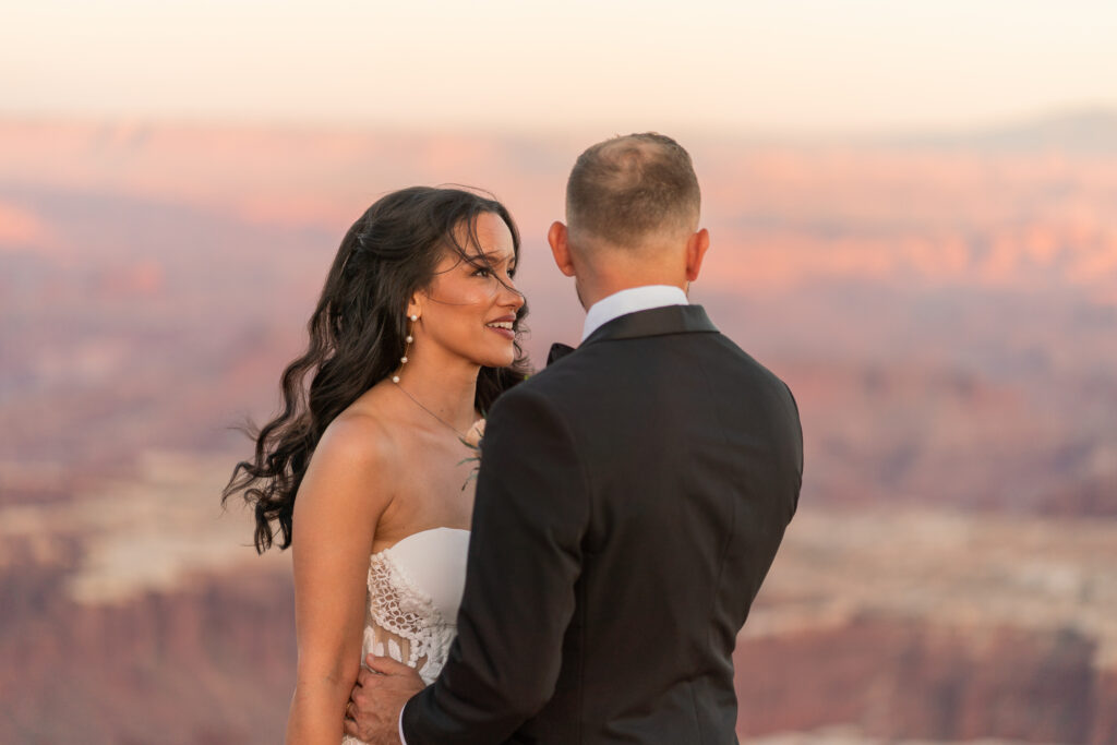 Sunset wedding portrait of the bride and groom eloping in the canyons of Moab utah