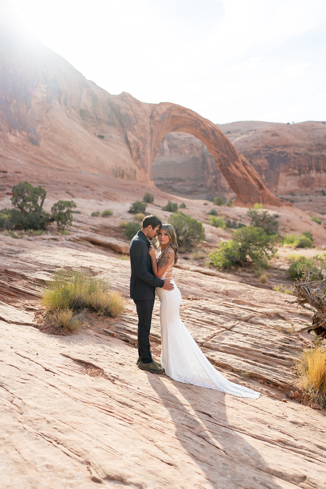 Bride + Groom posing in Canyonlands during Moab elopement