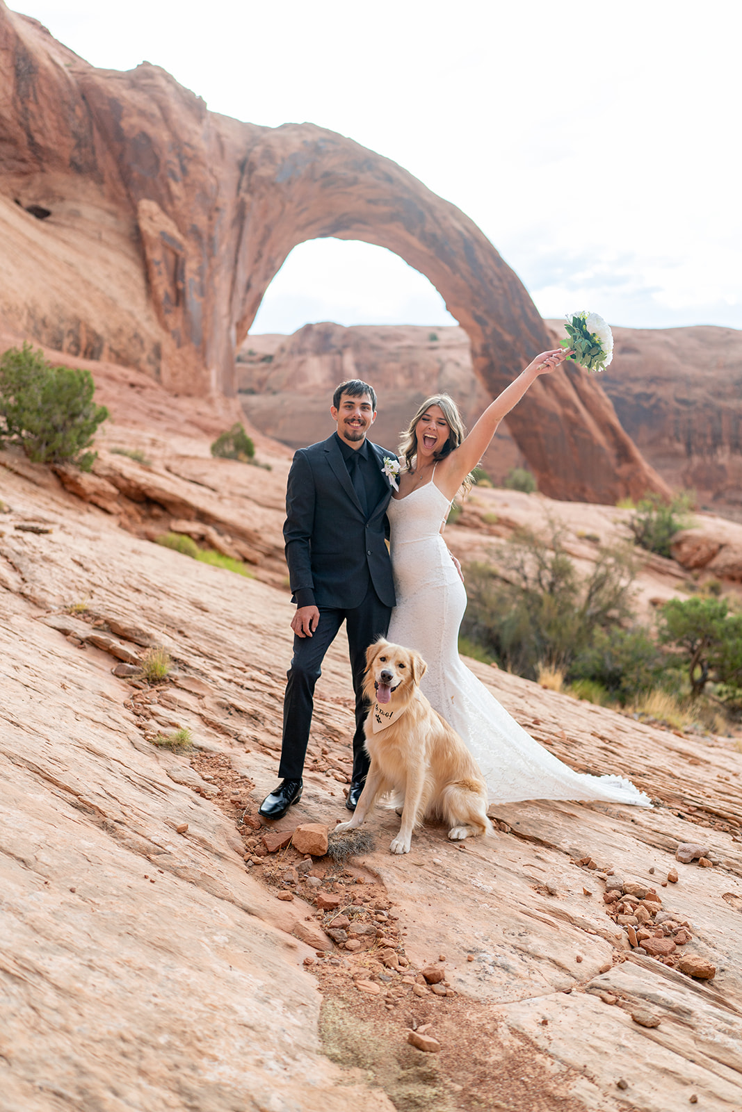 Couple posing at sunrise during Moab Utah elopement ceremony