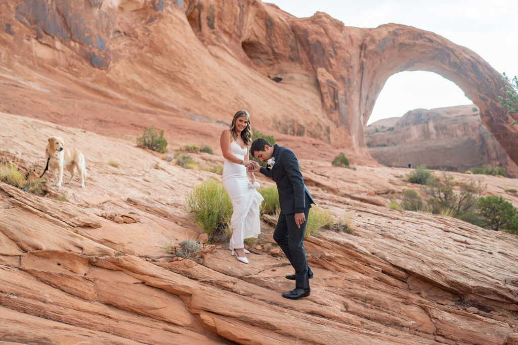 Bride + Groom hiking in Canyonlands during Moab elopement