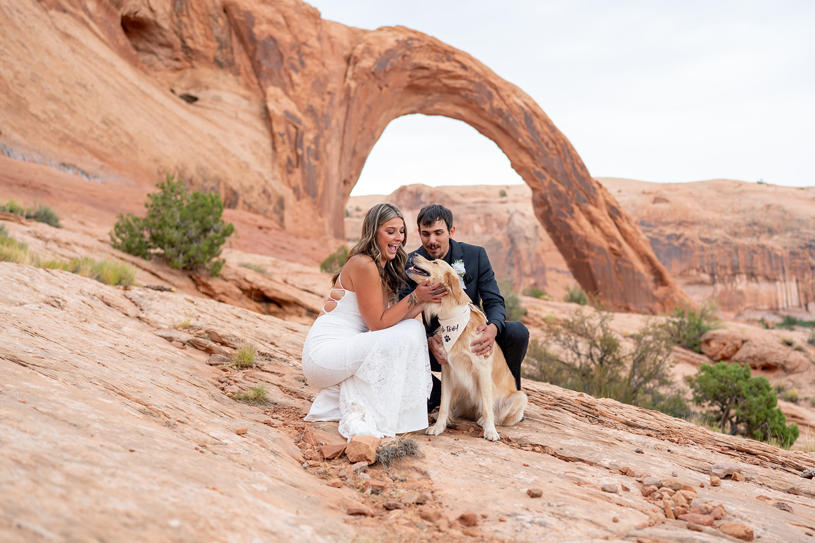 Couple hiking in Canyonlands during Moab elopement with marriage license completed