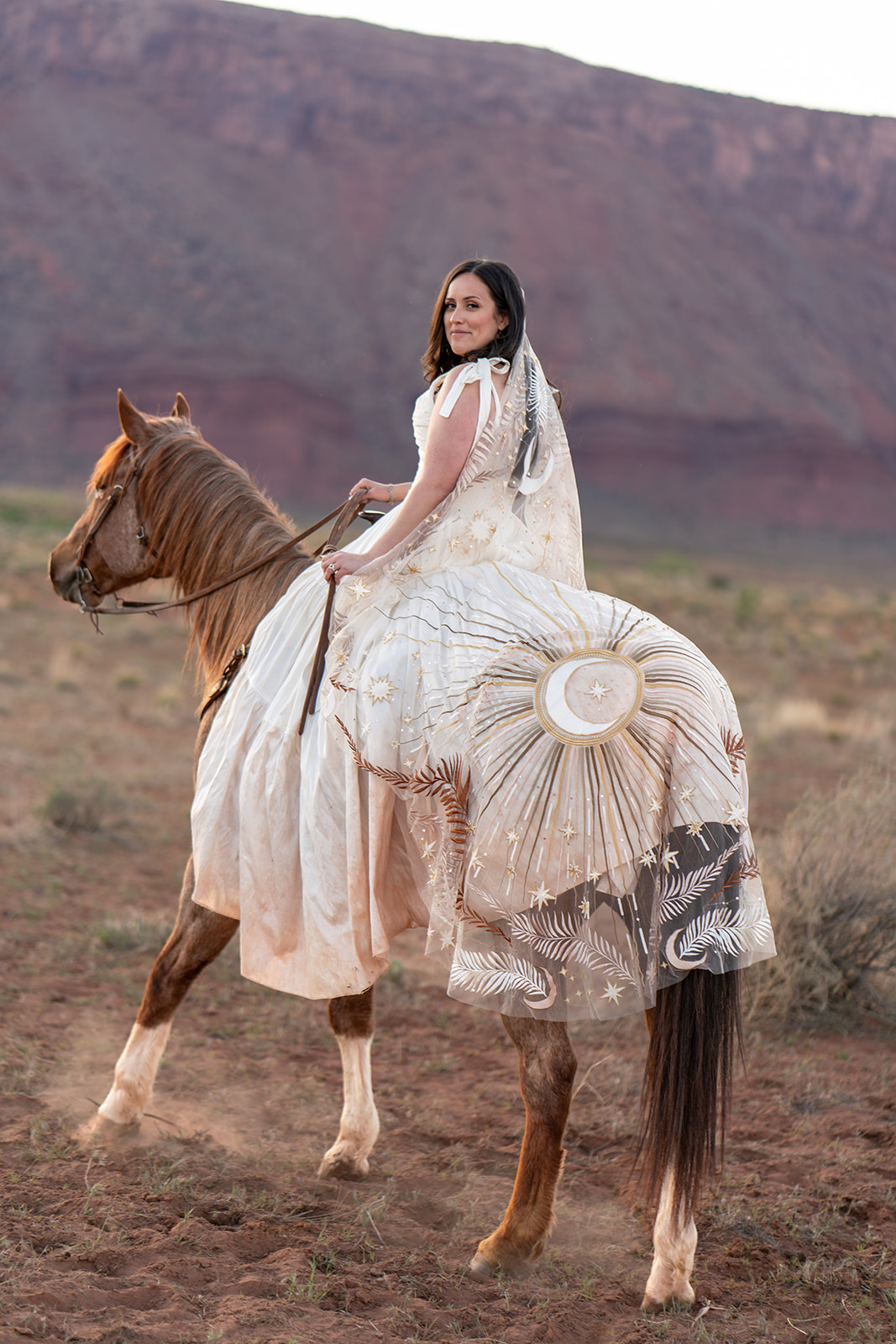Bride on horseback at a scenic Utah desert location