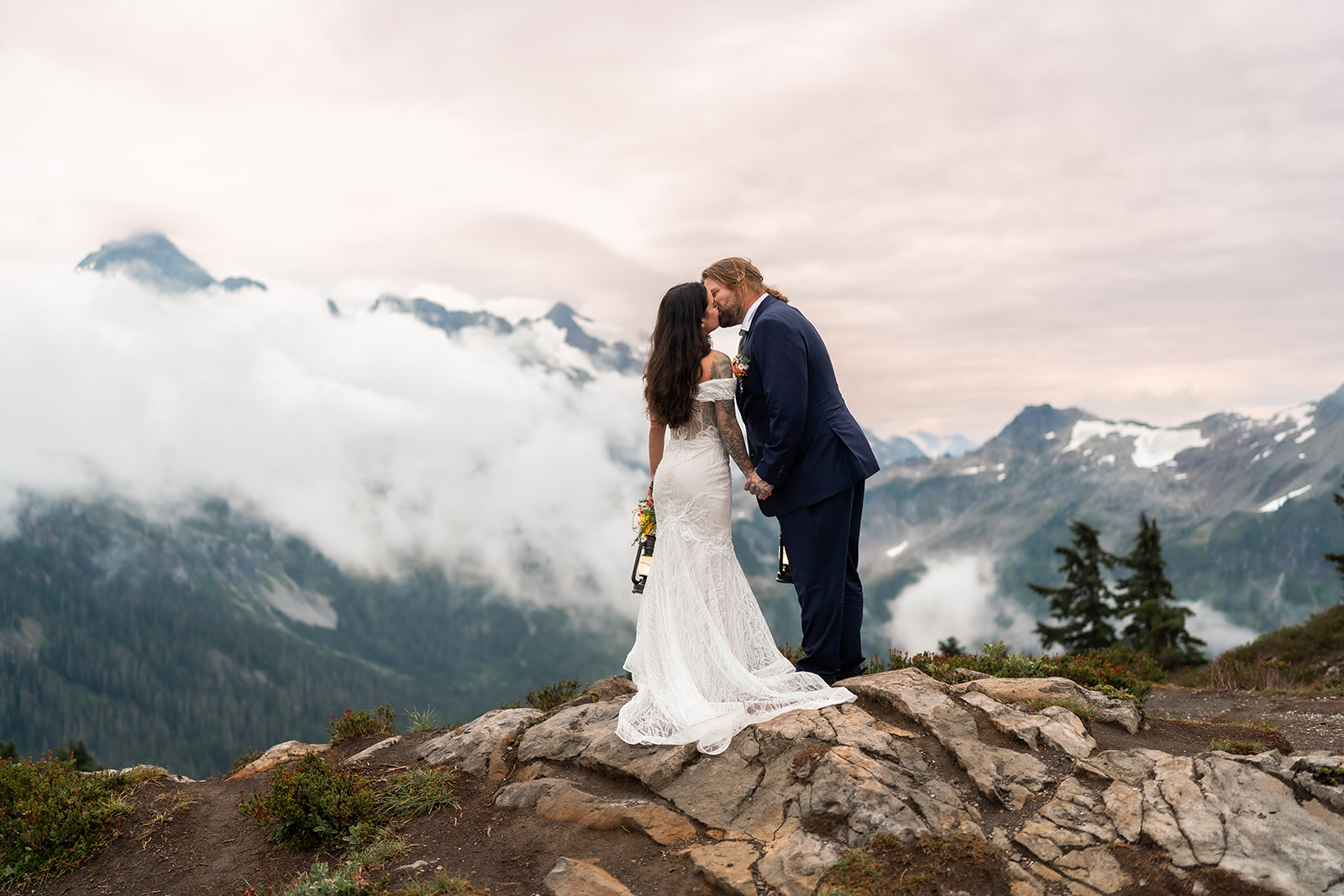 Bride and groom with flowers at desert elopement – All-Inclusive Elopement Package in the US