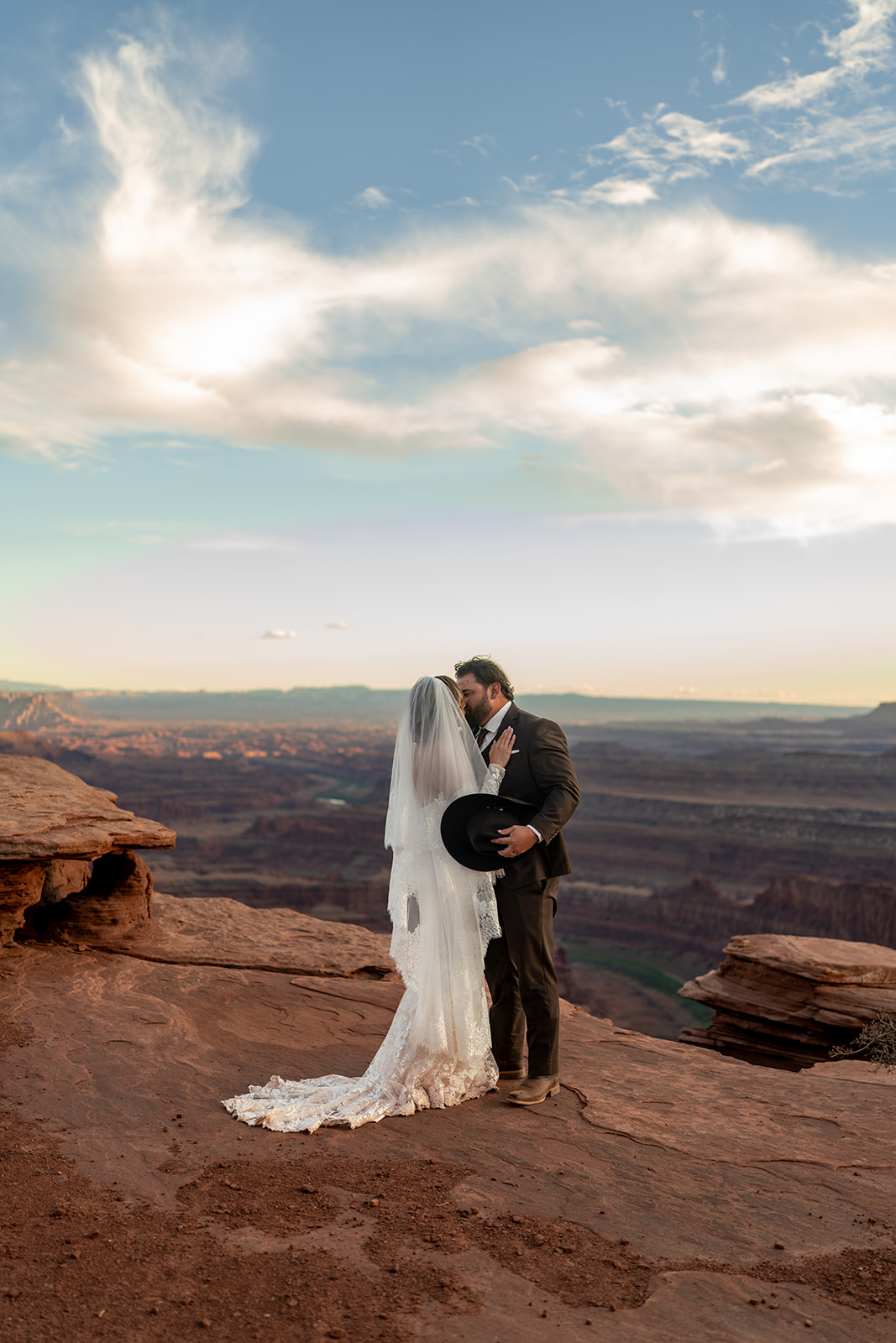 Romantic moment from their all-inclusive elopement wedding in the Utah