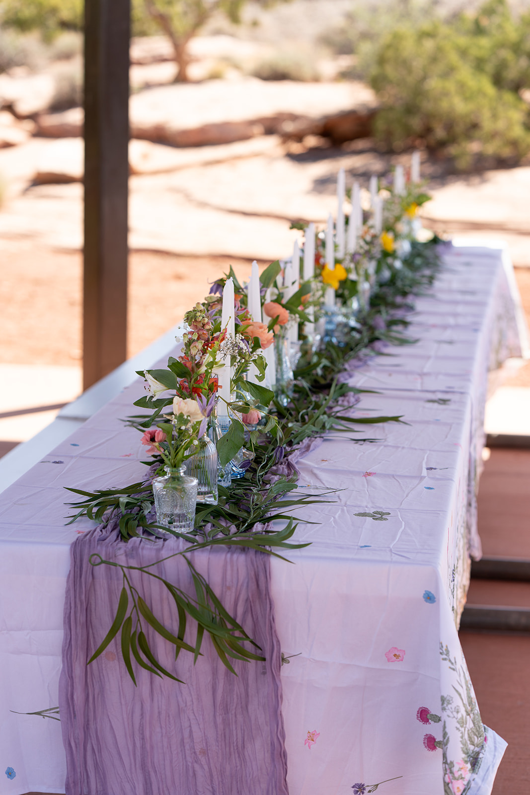 Reception table florals styled with desert elegance by Moab wedding florist