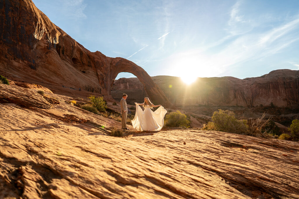 Bride and groom exchanging vows during an intimate destination elopement in Moab, Utah. The couple needed to know The Cost to Elope in 2025 before booking an elopement photographer